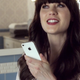 Illustration for article titled Ten Adorable Fun Super GIFs of Zooey Deschanel Talking to Siri